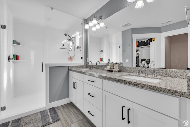 2144 S 120 E, Heber City, UT 84032 - full bathroom with double vanity, a spacious closet, and a shower stall