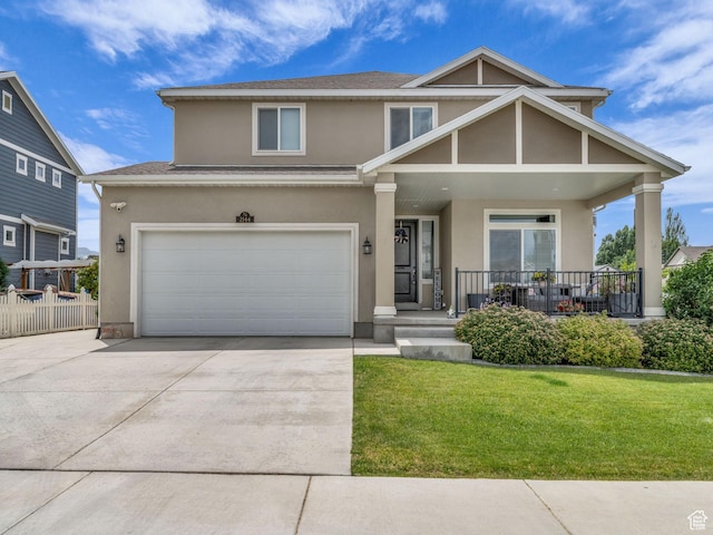 2144 S 120 E, Heber City, UT 84032 - view of front of property with stucco siding, a porch, driveway, and an attached garage
