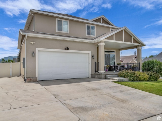 2144 S 120 E, Heber City, UT 84032 - view of front of house featuring covered porch, stucco siding, a garage, and driveway