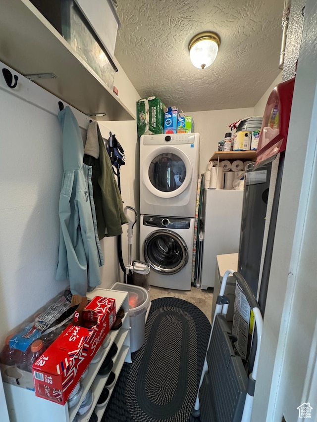 1150 W Red Hills Pkwy Unit 123, Washington, UT 84780 - laundry area with stacked washer and dryer and a textured ceiling
