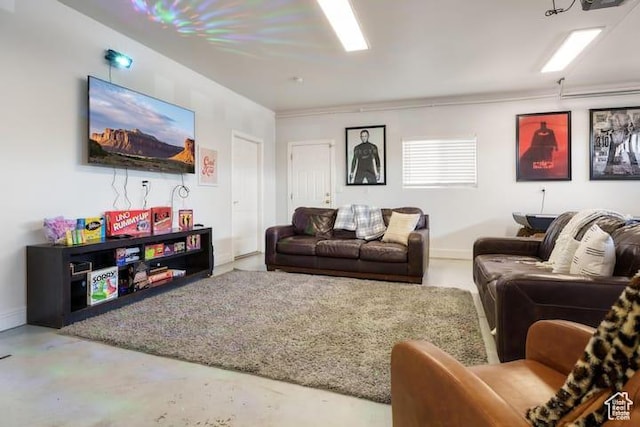 living room featuring concrete flooring