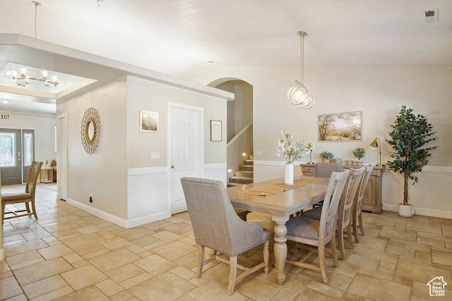 dining space featuring an inviting chandelier