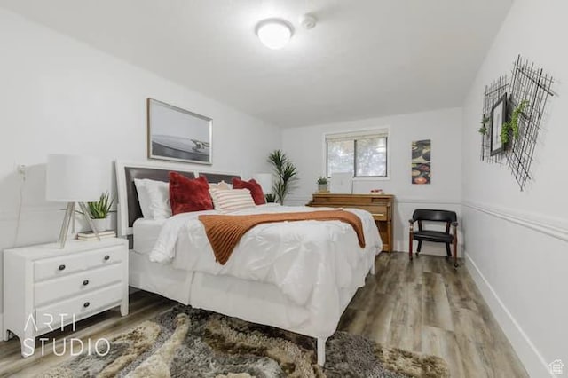 bedroom featuring wood-type flooring