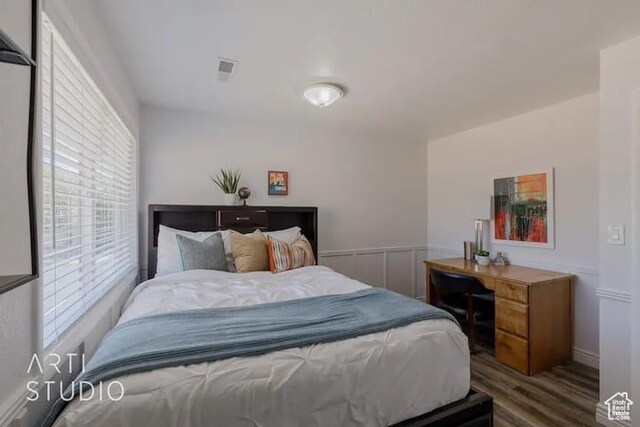 bedroom featuring dark hardwood / wood-style flooring