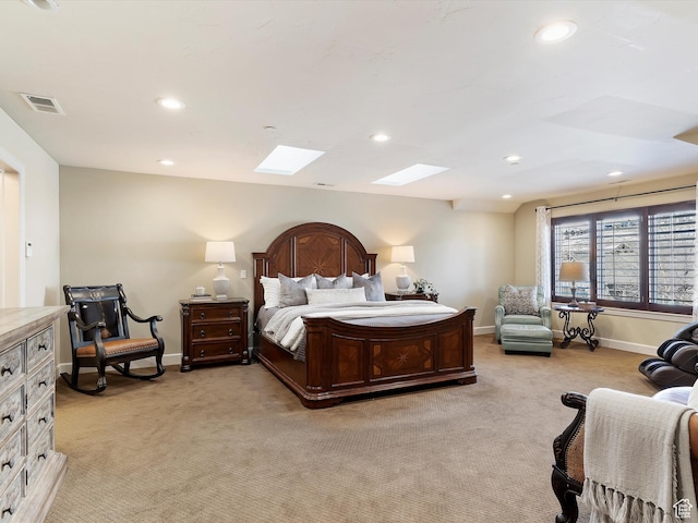 carpeted bedroom with a skylight