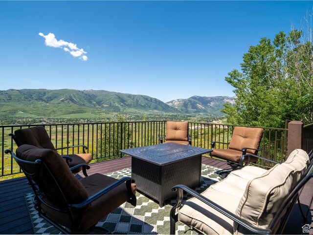 5932 E Big Horn Pkwy, Eden, UT 84310 - wooden terrace featuring a mountain view and outdoor lounge area