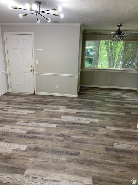 667 N 340 W, Orem, UT 84057 - unfurnished room featuring a chandelier, ornamental molding, wood finished floors, baseboards, and a textured ceiling