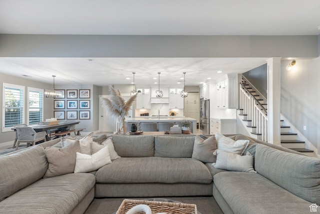 2305 E 3350 S, St George, UT 84790 - living area featuring baseboards, stairs, a chandelier, and recessed lighting