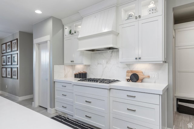 2305 E 3350 S, St George, UT 84790 - kitchen featuring light countertops, premium range hood, white cabinetry, and stainless steel gas stovetop