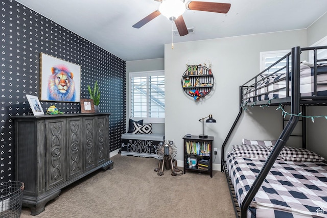 2305 E 3350 S, St George, UT 84790 - bedroom featuring an accent wall, wallpapered walls, baseboards, carpet flooring, and visible vents