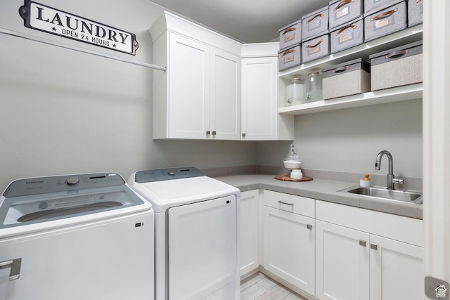 2305 E 3350 S, St George, UT 84790 - laundry room with independent washer and dryer, a sink, and cabinet space