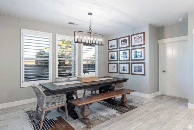 2305 E 3350 S, St George, UT 84790 - dining space with baseboards, light wood-style flooring, visible vents, and a chandelier