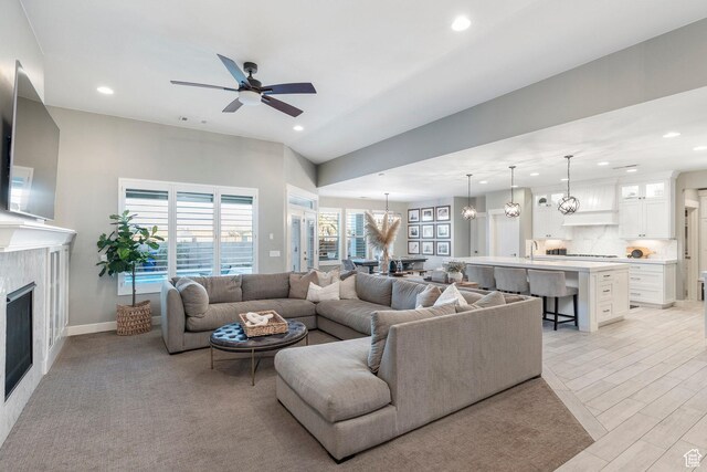 2305 E 3350 S, St George, UT 84790 - living area with recessed lighting, a tile fireplace, and ceiling fan with notable chandelier