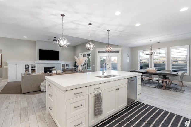 2305 E 3350 S, St George, UT 84790 - kitchen featuring ceiling fan with notable chandelier, dishwasher, light wood-style flooring, and a sink