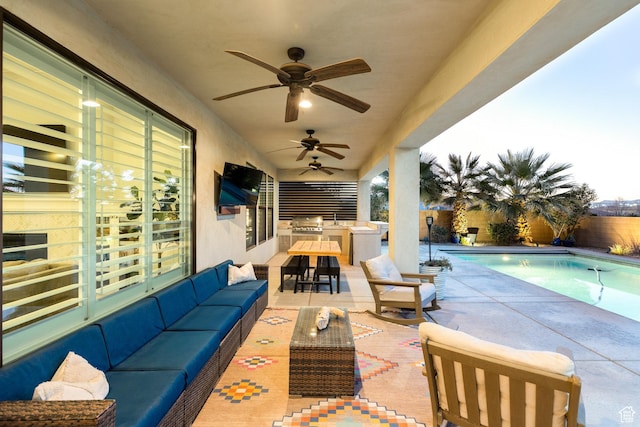 2305 E 3350 S, St George, UT 84790 - view of patio / terrace with a fenced in pool, exterior kitchen, a fenced backyard, an outdoor hangout area, and ceiling fan