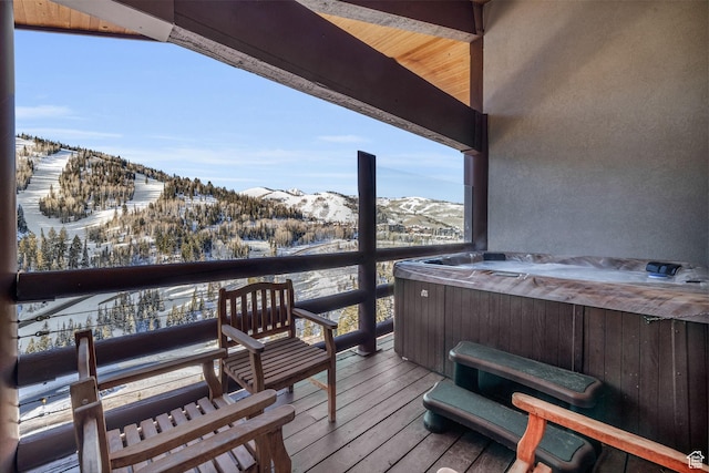 7700 Stein Way Unit 215, Park City, UT 84060 - snow covered deck featuring a hot tub and a mountain view