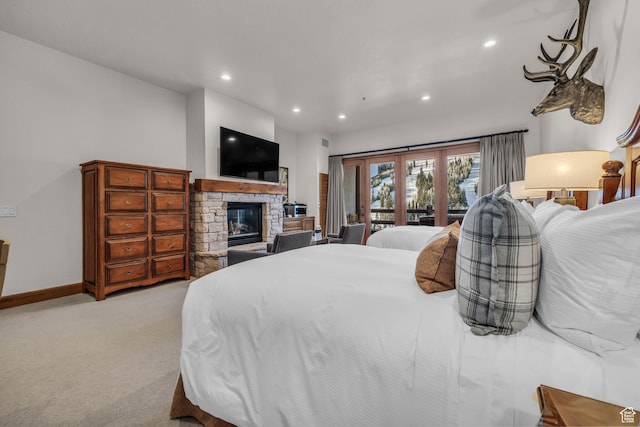 7700 Stein Way Unit 215, Park City, UT 84060 - carpeted bedroom featuring a stone fireplace and access to exterior