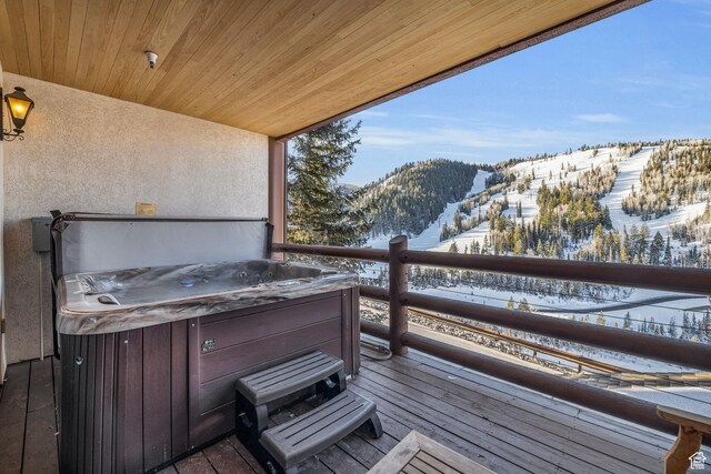 7700 Stein Way Unit 215, Park City, UT 84060 - snow covered deck with a hot tub and a mountain view