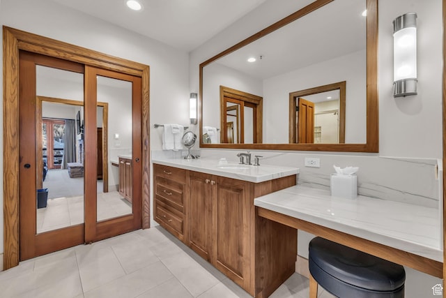 7700 Stein Way Unit 215, Park City, UT 84060 - bathroom featuring french doors, vanity, and tile patterned flooring