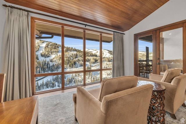 7700 Stein Way Unit 215, Park City, UT 84060 - sitting room with lofted ceiling, a mountain view, and wooden ceiling