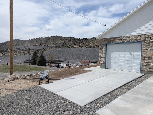 350 W Dublin S, Eureka, UT 84628 - exterior space with a mountain view, concrete driveway, and a garage
