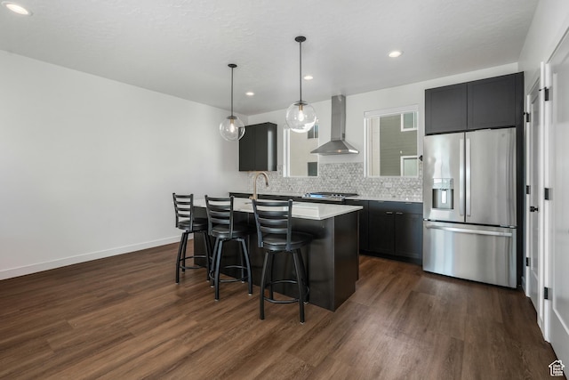 474 E Alice Way, Layton, UT 84041 - kitchen with dark wood-type flooring, tasteful backsplash, appliances with stainless steel finishes, pendant lighting, and wall chimney range hood