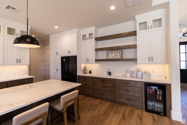 2802 E Rowan Ln, St George, UT 84790 - kitchen featuring hanging light fixtures, white cabinetry, and wine cooler