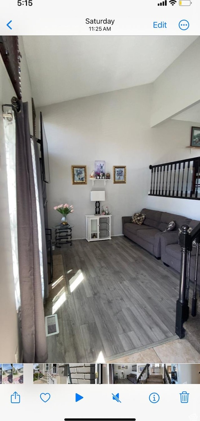 4466 W 6060 S, Salt Lake City, UT 84118 - living area featuring wood finished floors and lofted ceiling