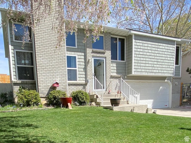 4466 W 6060 S, Salt Lake City, UT 84118 - view of front of house with an attached garage, a front yard, driveway, and brick siding