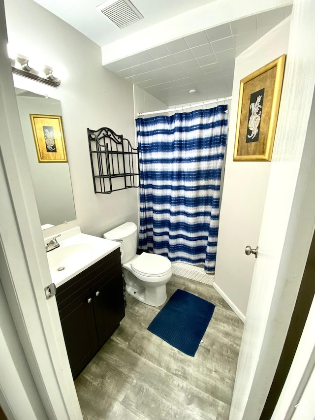 4466 W 6060 S, Salt Lake City, UT 84118 - bathroom with toilet, vanity, wood finished floors, and a shower with shower curtain