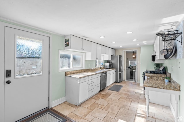 58 W 6100 S, Murray, UT 84107 - kitchen featuring white cabinetry, stainless steel appliances, and light stone counters