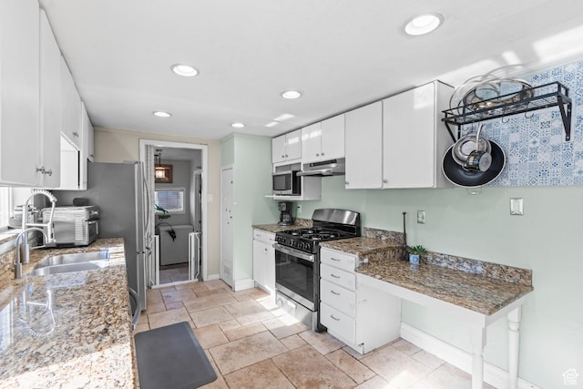 58 W 6100 S, Murray, UT 84107 - kitchen featuring sink, stainless steel appliances, dark stone counters, and white cabinets