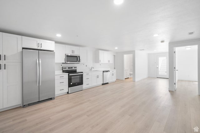 598 S Otto Ln, Grantsville, UT 84029 - kitchen with recessed lighting, light countertops, white cabinetry, stainless steel appliances, and a sink
