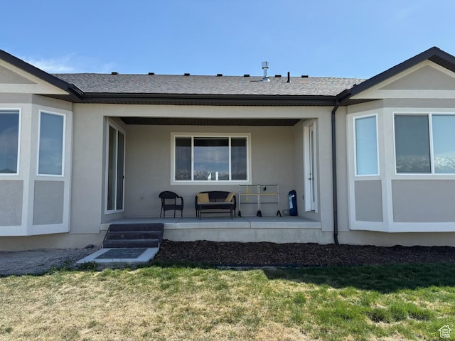 598 S Otto Ln, Grantsville, UT 84029 - back of house with a yard, covered porch, and stucco siding