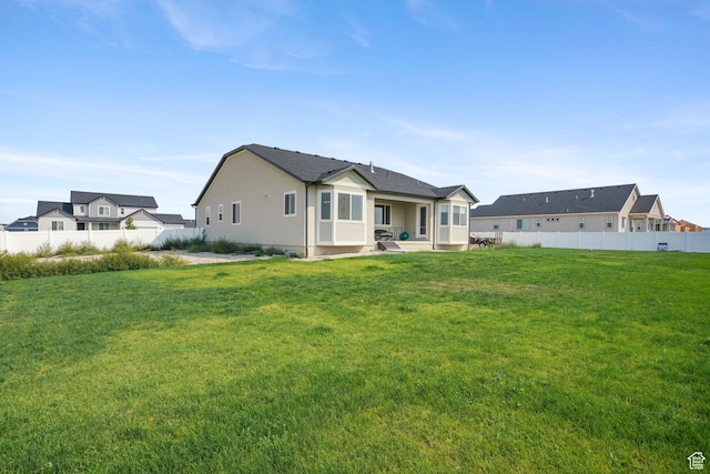 598 S Otto Ln, Grantsville, UT 84029 - back of property with a yard, fence, and a patio area