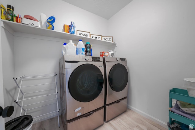 598 S Otto Ln, Grantsville, UT 84029 - laundry room with washing machine and dryer, laundry area, baseboards, and wood finished floors