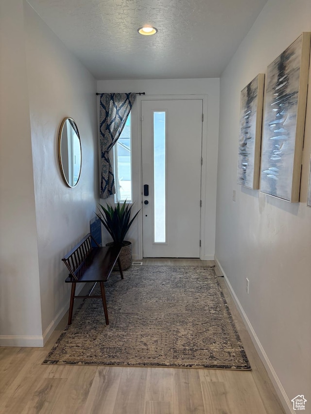 598 S Otto Ln, Grantsville, UT 84029 - entryway featuring a textured ceiling, wood finished floors, and baseboards