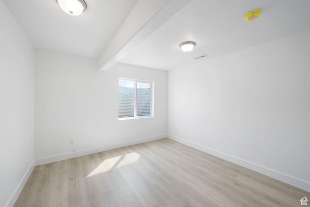 598 S Otto Ln, Grantsville, UT 84029 - spare room featuring baseboards, light wood finished floors, beam ceiling, and visible vents