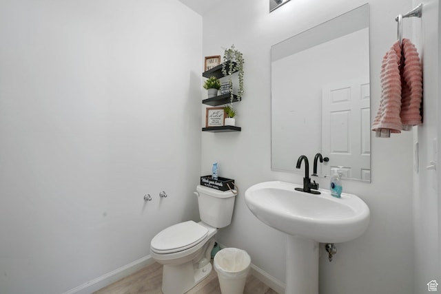 598 S Otto Ln, Grantsville, UT 84029 - bathroom with baseboards, toilet, and wood finished floors