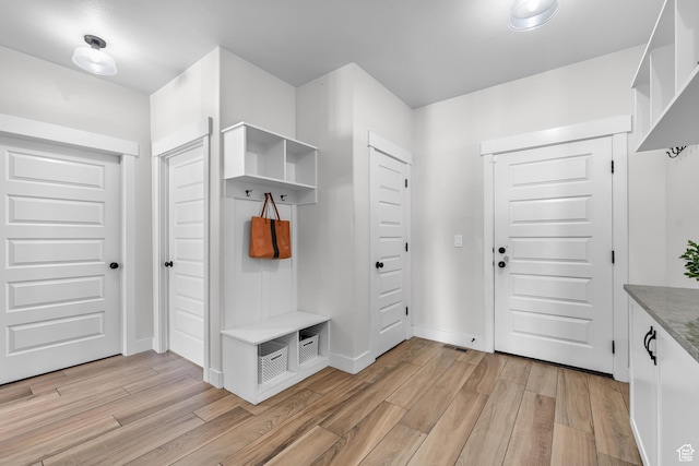3727 S Larkspur Cir, Saratoga Springs, UT 84045 - mudroom featuring baseboards and light wood-style flooring