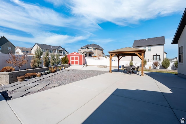 3727 S Larkspur Cir, Saratoga Springs, UT 84045 - view of patio / terrace featuring a fenced backyard, a gazebo, a storage unit, a residential view, and an outdoor structure