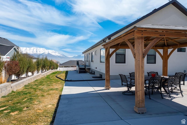 3727 S Larkspur Cir, Saratoga Springs, UT 84045 - view of patio featuring outdoor dining area, a mountain view, and fence