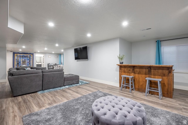 518 N 1980 E, Spanish Fork, UT 84660 - living area with wood finished floors, visible vents, and baseboards