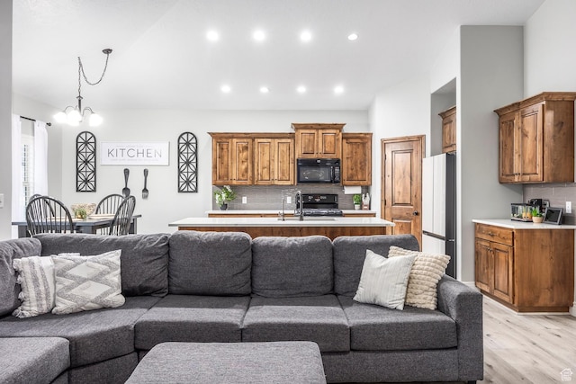 518 N 1980 E, Spanish Fork, UT 84660 - living area with light wood-style flooring and recessed lighting