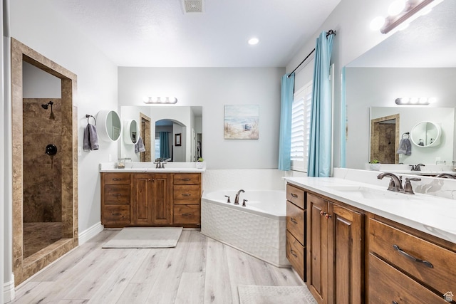 518 N 1980 E, Spanish Fork, UT 84660 - bathroom with a bath, wood finished floors, a tile shower, and a sink