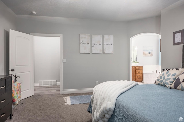 518 N 1980 E, Spanish Fork, UT 84660 - carpeted bedroom featuring ensuite bath, visible vents, and baseboards