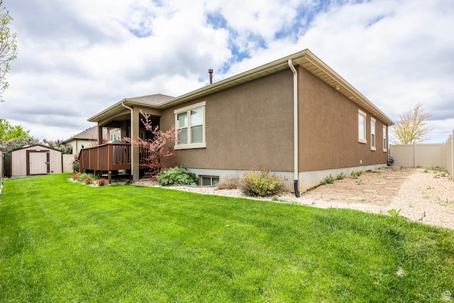 518 N 1980 E, Spanish Fork, UT 84660 - rear view of house featuring a shed, an outbuilding, a wooden deck, and stucco siding
