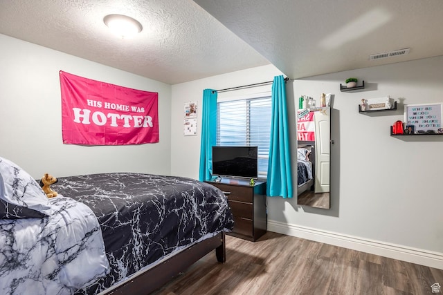 518 N 1980 E, Spanish Fork, UT 84660 - bedroom with a textured ceiling, visible vents, wood finished floors, and baseboards