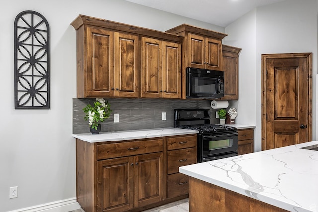 518 N 1980 E, Spanish Fork, UT 84660 - kitchen featuring baseboards, black appliances, light stone countertops, and decorative backsplash