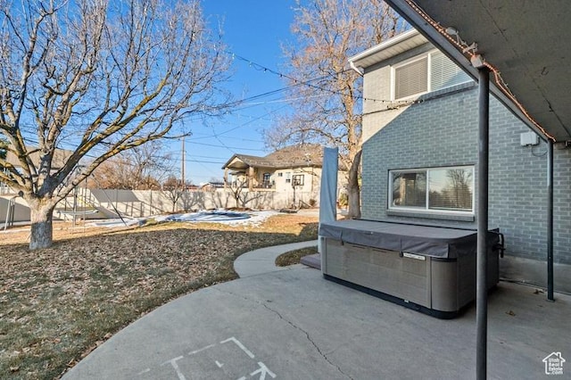 view of patio with a hot tub